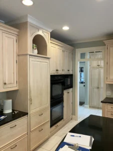 North Raleigh kitchen with light brown cabinets and black granite countertops before remodeling.