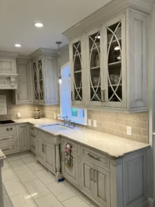 North Raleigh kitchen after remodel showcasing a cohesive gray color palette with upgraded cabinets, countertops, and appliances.