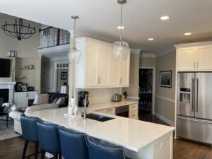 Completed kitchen remodel in Wake Forest, NC featuring custom cabinetry, updated countertops, modern lighting, and a functional open layout by A&M Remodeling.